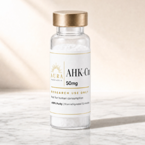 Clear glass vial of 50mg AHK-Cu with a metallic gold cap containing white powder, label reads Aura Research, AHK-Cu 50 mg, for research use only; not for human consumption.