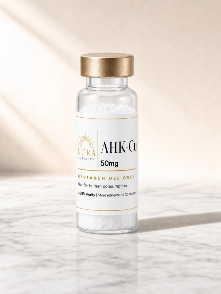 Clear glass vial of 50mg AHK-Cu with a metallic gold cap containing white powder, label reads Aura Research, AHK-Cu 50 mg, for research use only; not for human consumption.